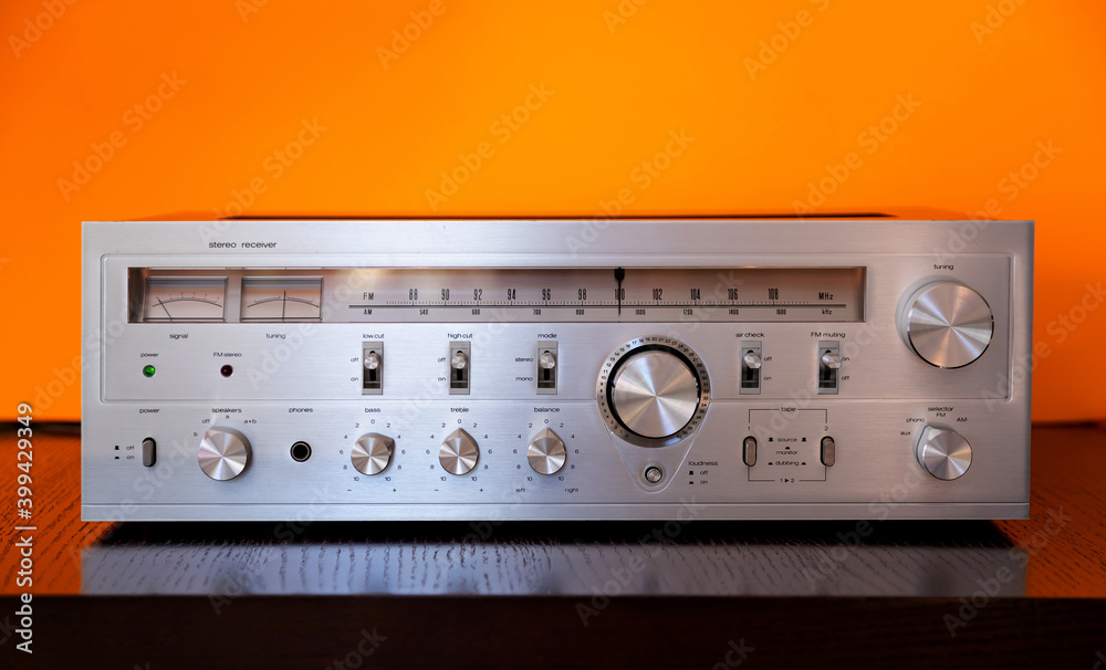 Obraz premium Vintage Audio Stereo Receiver with shiny metal front panel