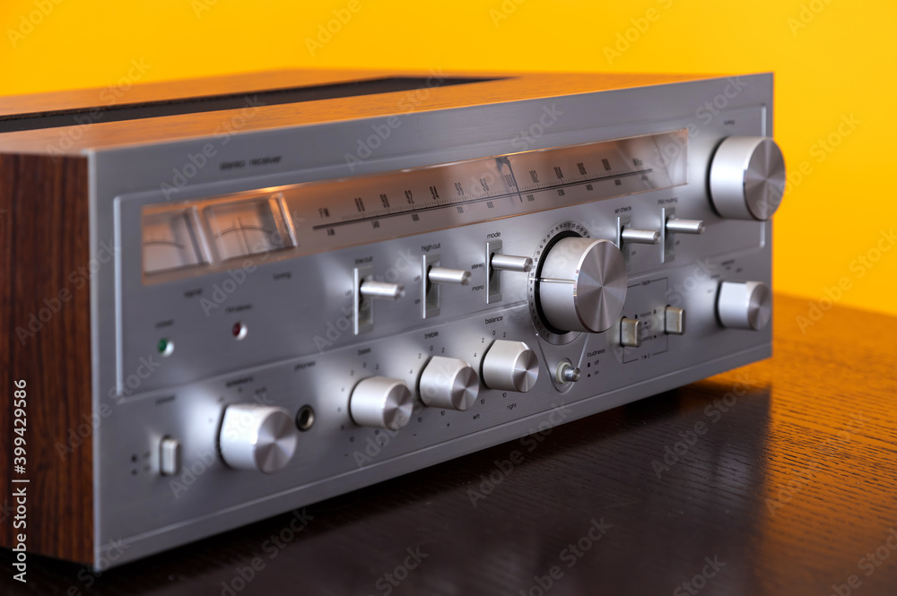 Fototapeta premium Vintage Audio Stereo Receiver with shiny metal front panel