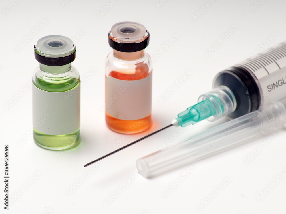 Close up shoot of vaccine on a bottle, capture on white isolated background Close up shoot of vaccine on a bottle, capture on white isolated background