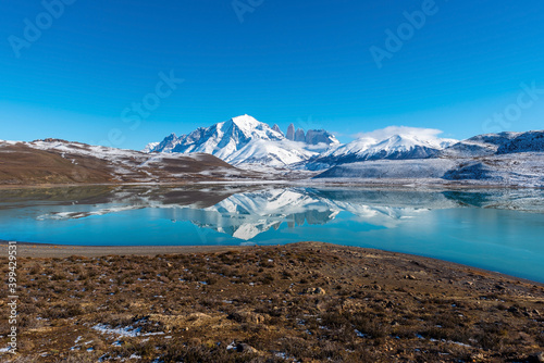 Reflection of the Torres del Paine peaks in the Bitter Lagoon (Laguna Amarga) in winter, Torres del Paine national park, Patagonia, Chile.