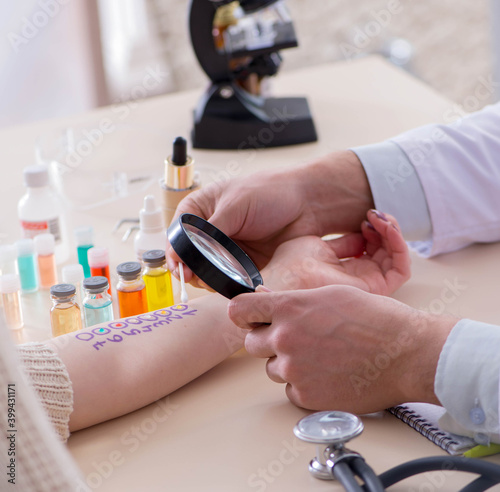 Doctor testing allergy reaction of patient in hospital photo