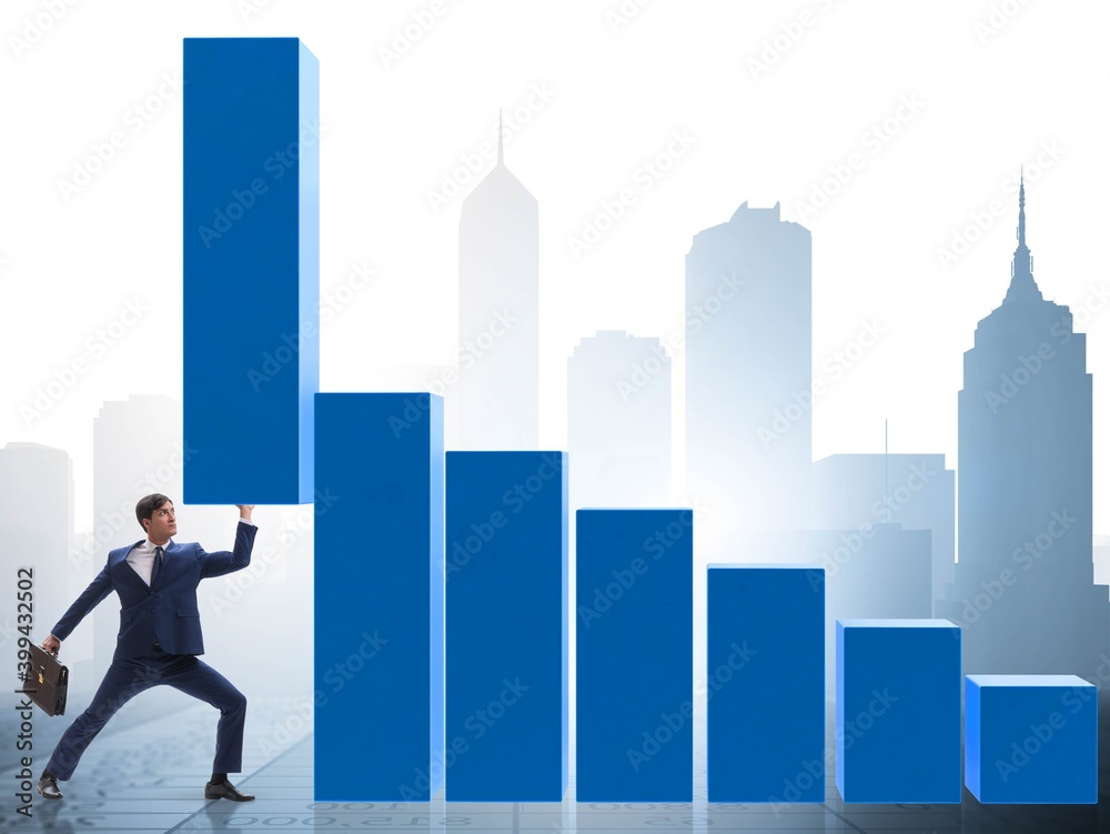 Businessman supporting growtn in economy on chart graph Businessman supporting growtn in economy on chart graph