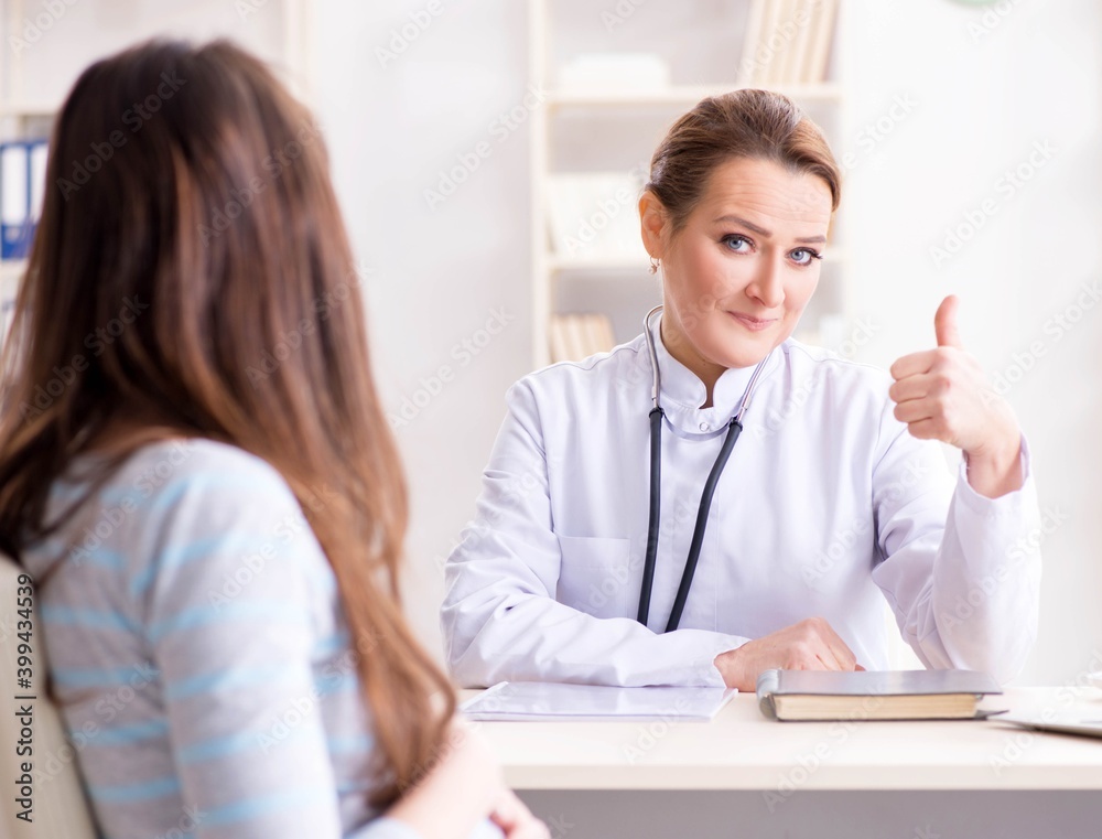 Pregnant woman visiting doctor for regular check-up Pregnant woman visiting doctor for regular check-up