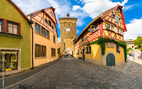 Clock tower at Spitalgasse street in Rothenburg ob der Tauber. Bavaria, Germany