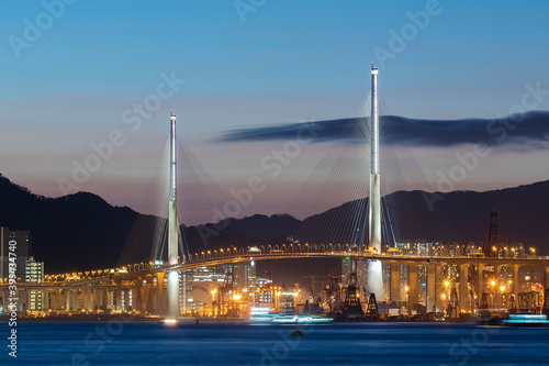 Photography Suspension bridge in Hong Kong harbor at dusk