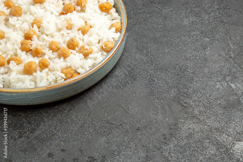 Quick and easy peas and rice meal for dinner on dark background photo