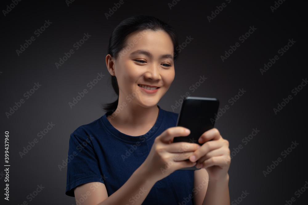 Asian woman happy surprised holding smart phone. Asian woman happy surprised holding smart phone.