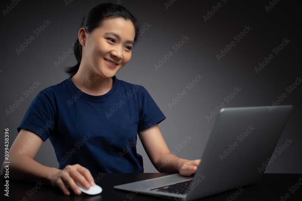 Asian woman working with laptop. Asian woman working with laptop.