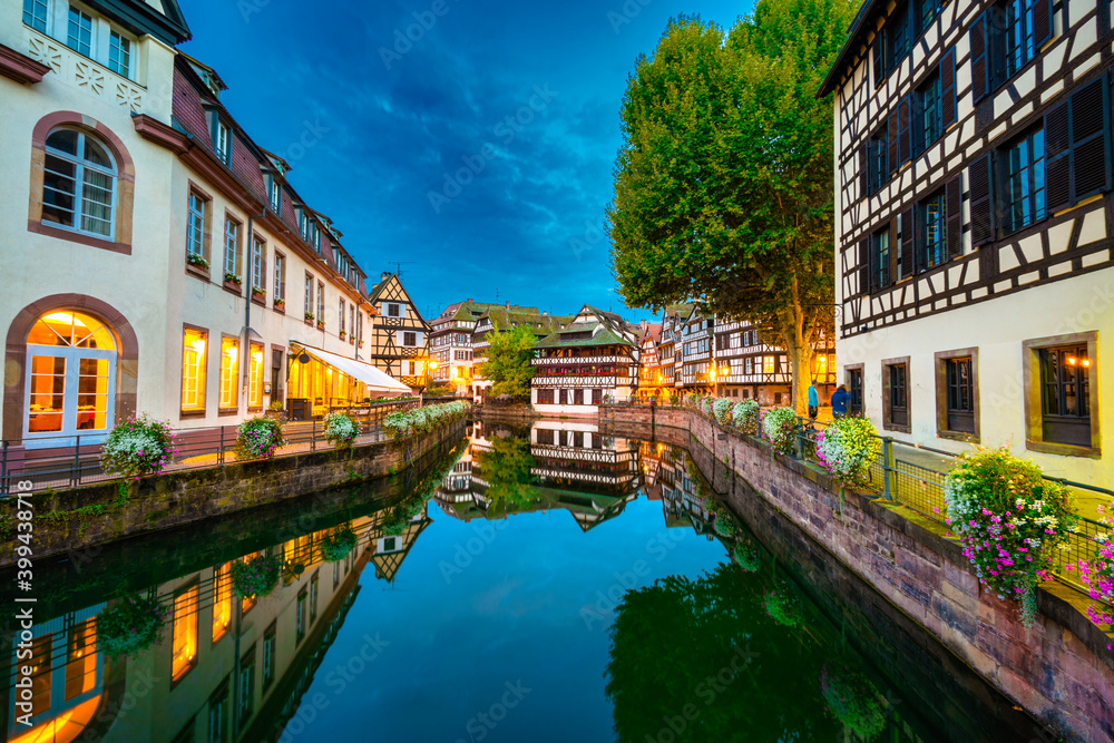 canal of Strasbourg at dusk, Alsace, France. Traditional half timbered houses of Petite France