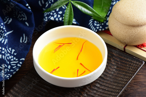 Close-up pictures of traditional Chinese medicine saffron tea on the background of retro Chinese style