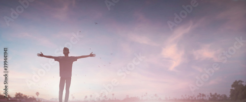 Happy man rise hand on morning view. Christian inspire praise God on good friday background. Male self confidence empowerment on mission arm courage nature the sun concept strength wisdom