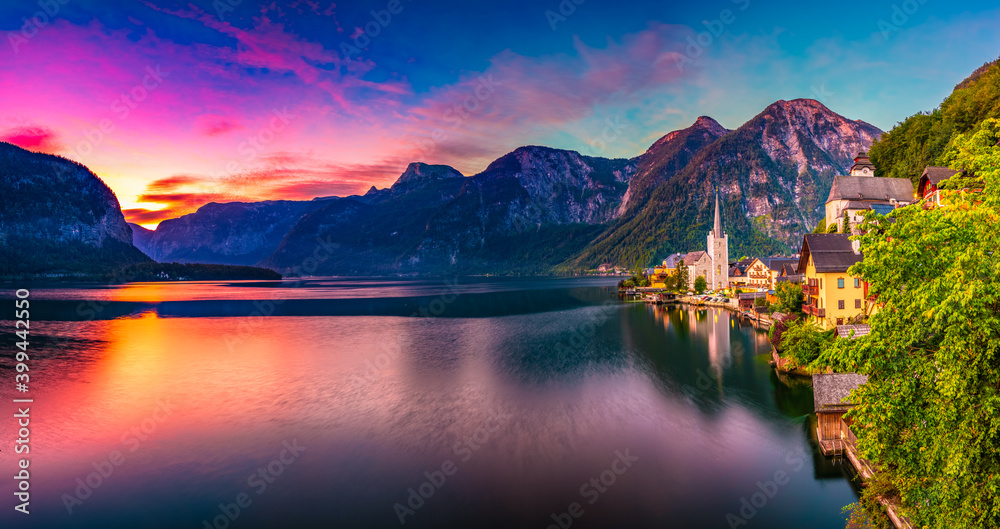Beautiful summer Alpine Hallstatt Town panorama and lake Hallstatter at dawn. Austria