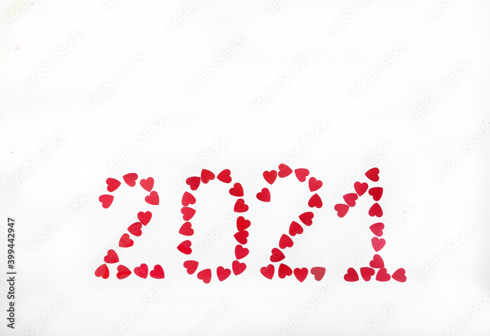 2021 lined with red glittering hearts on white background. New Year. Place for text. Copy space.