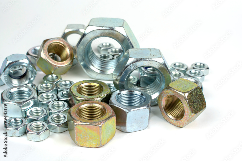close-up of various metal nuts for fastening products close-up of various metal nuts for fastening products