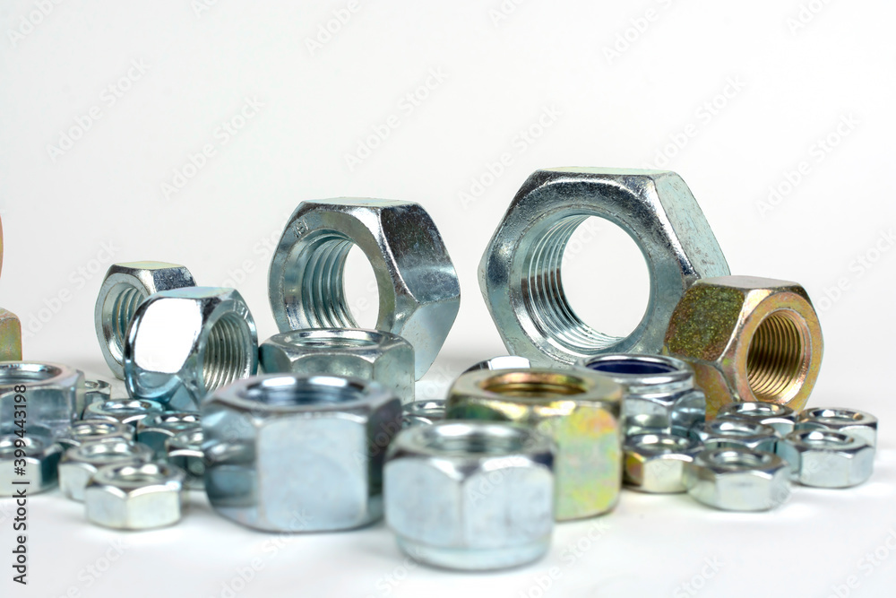 close-up of various metal nuts for fastening products close-up of various metal nuts for fastening products