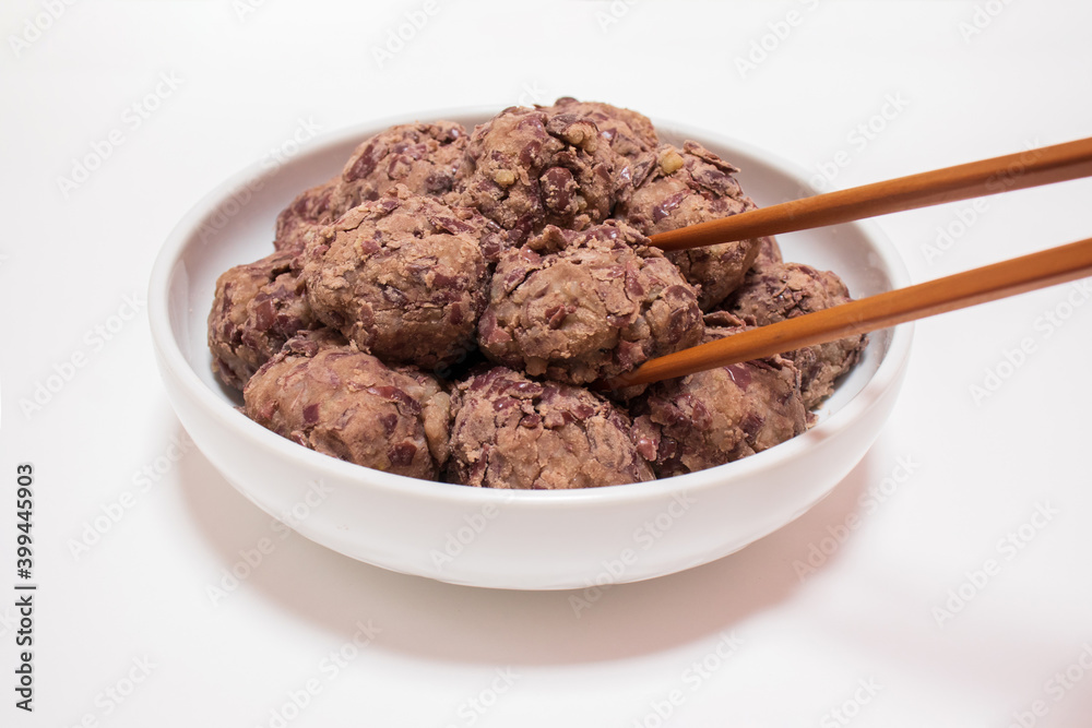 Korean traditional rice cake made from the glutinous rice and coated with mashed adzuki beans. homemade food, Injeolmi, tteok. Korean traditional rice cake made from the glutinous rice and coated with mashed adzuki beans. homemade food, Injeolmi, tteok.