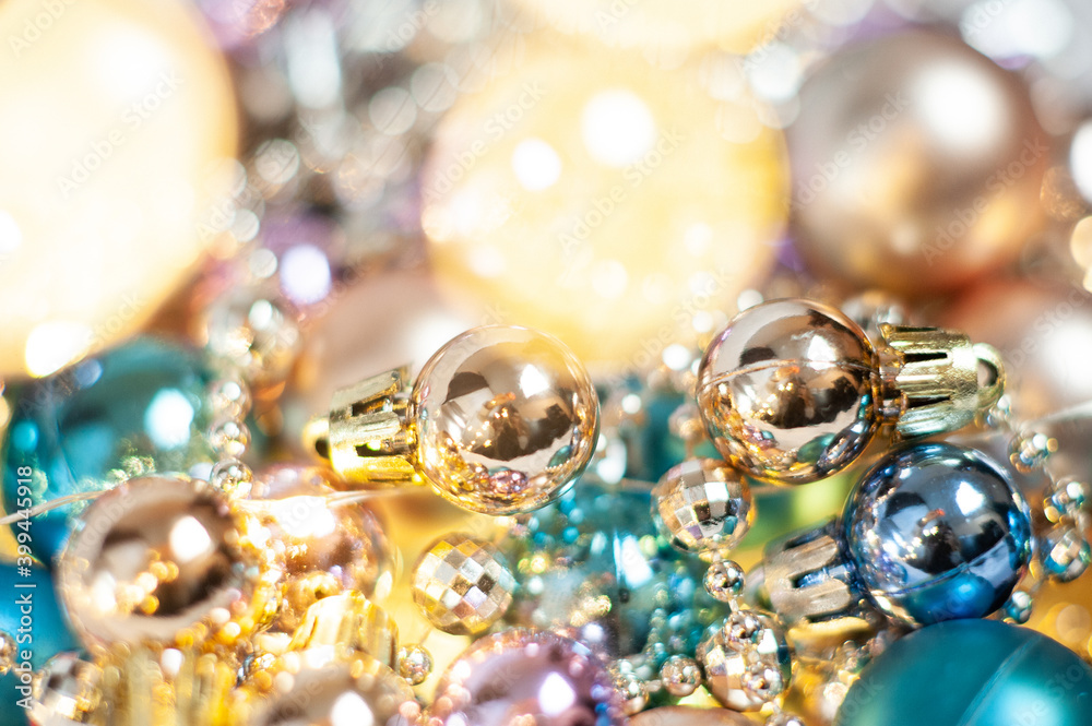 Gold and blue Christmas decorations on the Christmas tree. Different shades of gold. Close up. Macro photo. Holiday. Happy Christmas. Side.