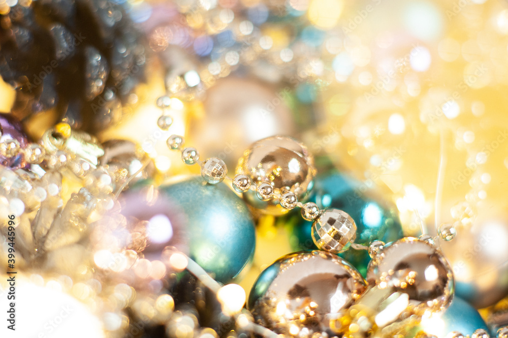 Gold and blue Christmas decorations on the Christmas tree. Different shades of gold. Close up. Macro photo. Holiday. Happy Christmas. Side. Gold and blue Christmas decorations on the Christmas tree. Different shades of gold. Close up. Macro photo. Holiday. Happy Christmas. Side.