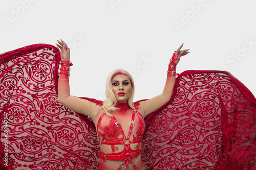 Spectacular photo of transgender with cape wearing an exotic drag queen costume. transsexual photo