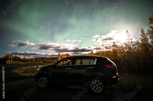 car in the night with aurora borealis © Brenda
