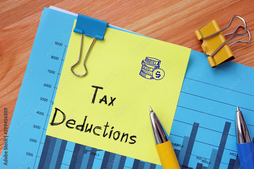 Financial concept meaning Tax Deductions with phrase on the page. Financial concept meaning Tax Deductions with phrase on the page.