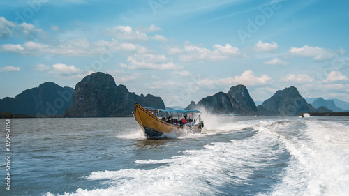 relax view with wood boat and clean sea in thailand photo
