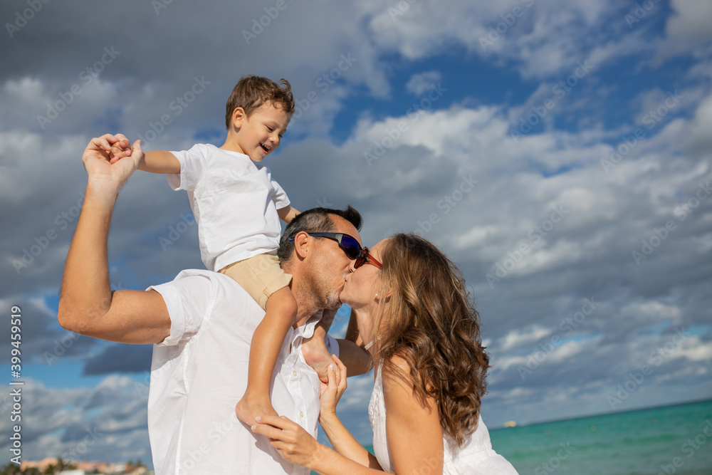 Happy family on the beach. Family vacation Happy family on the beach. Family vacation