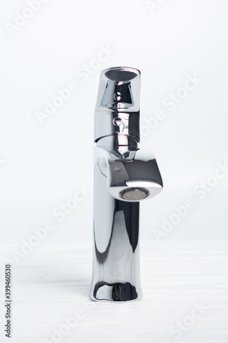 Contemporary chrome washbasin mixer. Modern mixer in bathroom