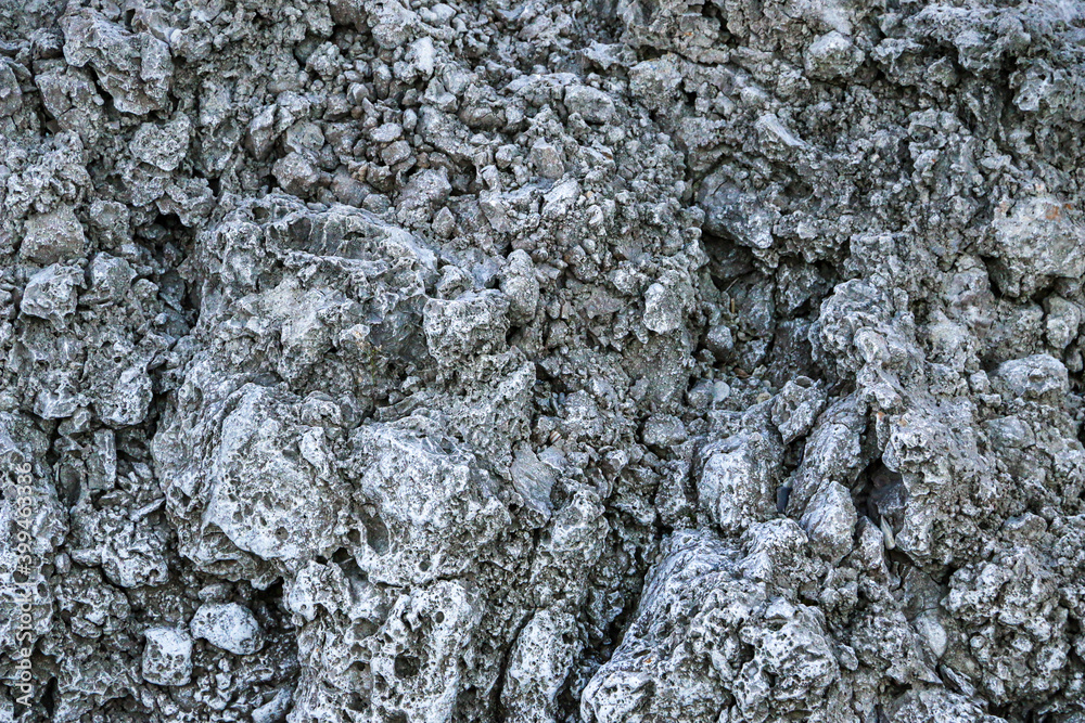 mountain textures of stones with interlayers of gypsum, colored quartz, clay, sand and other layers of various ores, with different textures, color and density, in gypsum ore quarry. mountain textures of stones with interlayers of gypsum, colored quartz, clay, sand and other layers of various ores, with different textures, color and density, in gypsum ore quarry.