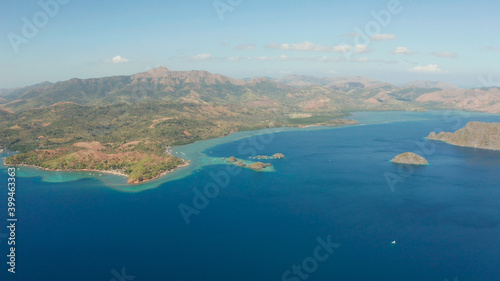 Aerial tropical landscape, lagoon with blue water and mountains of tropical island .lagoons and coves with blue water among the rocks. lagoon, mountains covered with forests. Seascape, tropical