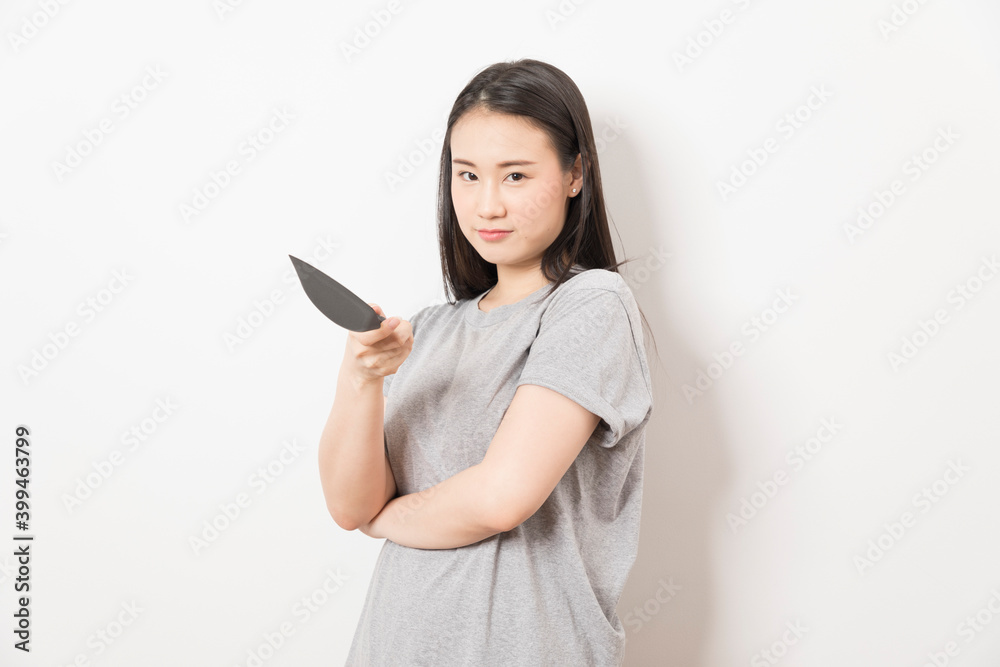 Asian woman holding ladle ready for cooking isolated on white background. Asian woman holding ladle ready for cooking isolated on white background.
