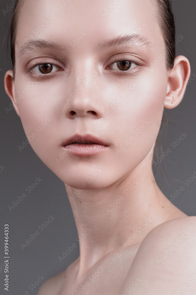 Beauty young woman portrait. Beautiful model girl with perfect fresh clean skin. Youth and skin care concept. Nude makeup Beauty young woman portrait. Beautiful model girl with perfect fresh clean skin. Youth and skin care concept. Nude makeup