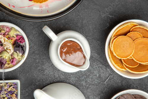 Wallpaper Mural top view yummy pancakes with cup of tea on dark background sweet pie dessert cakes Torontodigital.ca