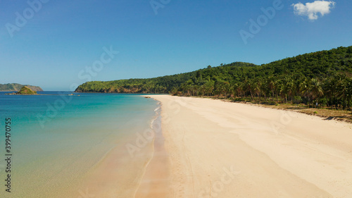 Blue sea and tropical beach, aerial drone. Nacpan, El Nido, Palawan, Philippine Islands. Seascape with tropical beach and islands. Summer and travel vacation concept © Alex Traveler