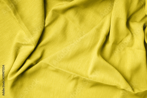 Yellow fabric texture background. Top View of cloth textile surface. Demonstrating trendy Color of the Year 2021. Illuminating Yellow and Ultimate Gray. Duotone. Abstract backdrop for design