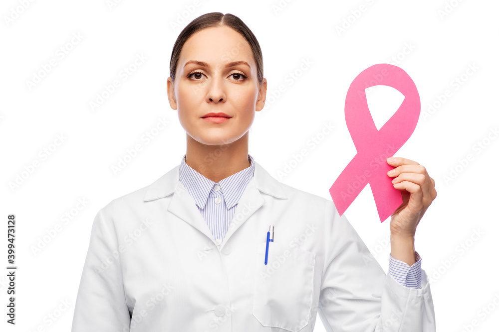 medicine, healthcare and oncology concept - female doctor in white coat with pink breast cancer awareness ribbon medicine, healthcare and oncology concept - female doctor in white coat with pink breast cancer awareness ribbon
