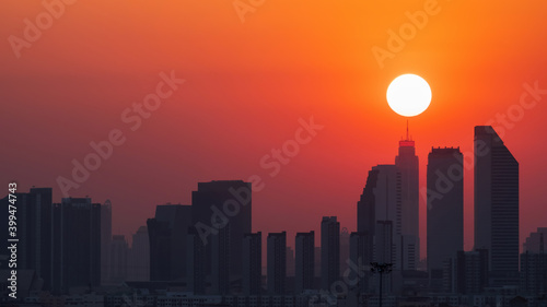 Aerial view of Bangkok skyline at sunset.