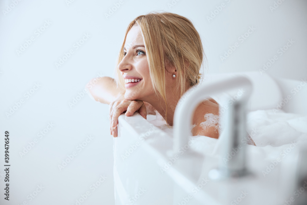 Charming pretty lady enjoying cool time while spending it in spa resort Charming pretty lady enjoying cool time while spending it in spa resort