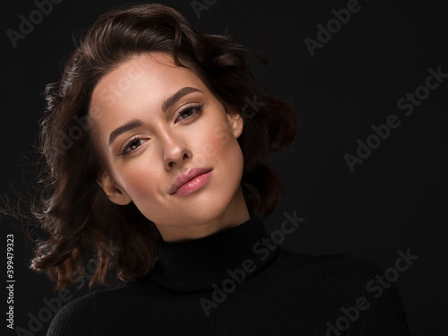 Beautiful face close up woman portrait face over black background