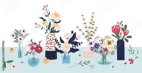 Beautiful bouquets of cut meadow and garden flowers in ceramic and glass vases standing on the table. Elegant bunches of wildflowers in florist shop. Vector illustration in flat cartoon style