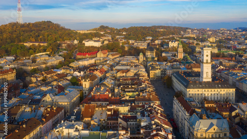 Rooftops of the old town in Lviv in Ukraine during the day. The magical atmosphere of the European city. Landmark, the city hall and the main square. Drone photo.
