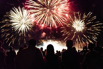 Crowd watching fireworks and celebrating new year eve