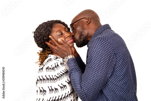 Tableau sur toile adult man kissing his wife on the cheek