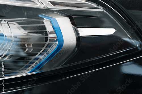 Headlights of a new white luxury car © fotofabrika