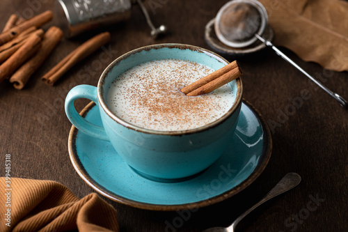 Turkish traditional hot drink salep on wooden background, selective focus photo
