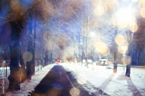abstract blurred background, landscape christmas snow city street falling snowflakes, holidays winter