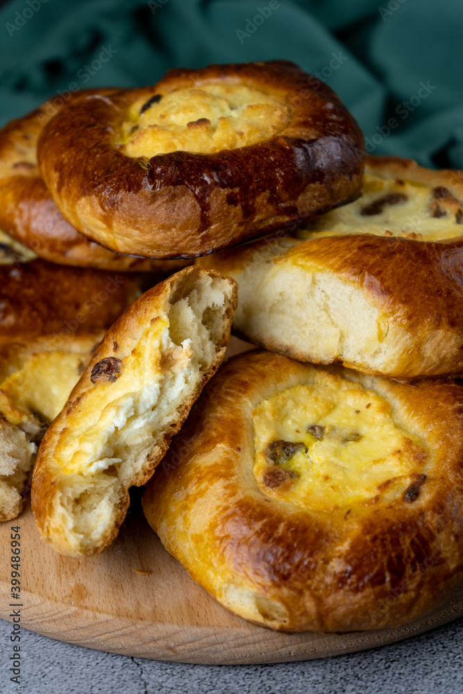 Traditional Russian baking pastry vatrushka, round buns, curd tart selective focus, closeup. Cheesecake with cottage cheese. Rustic food Photography. Traditional Russian baking pastry vatrushka, round buns, curd tart selective focus, closeup. Cheesecake with cottage cheese. Rustic food Photography.
