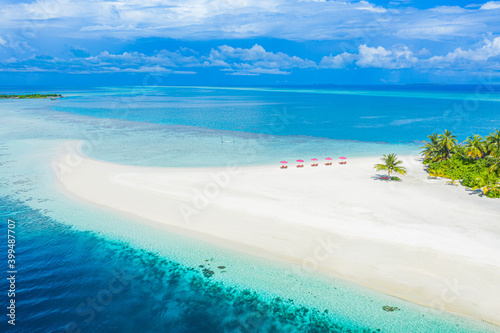 Aerial photo of beautiful Maldives paradise tropical beach. Amazing view, blue turquoise lagoon water, palm trees and white sandy beach. Luxury travel vacation destination. Sunny aerial landscape 