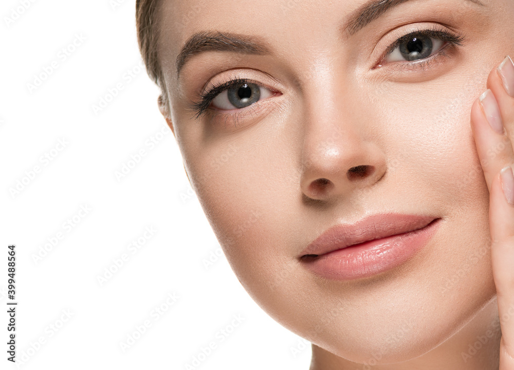 Beautiful woman face with healthy clean beauty skin close up Beautiful woman face with healthy clean beauty skin close up