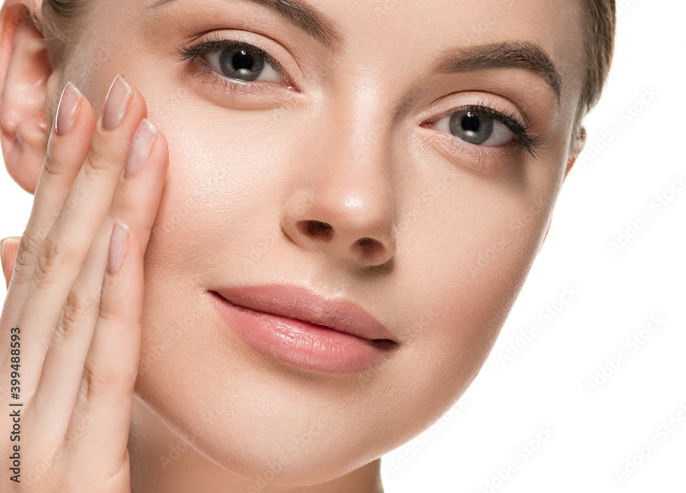 Beautiful woman face with healthy clean beauty skin close up Beautiful woman face with healthy clean beauty skin close up